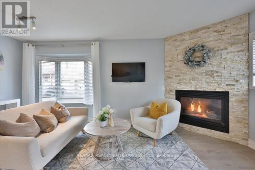 21 - 1385 Lakeshore Road W, Mississauga, ON - Indoor Photo Showing Living Room With Fireplace
