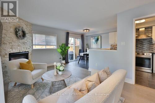 21 - 1385 Lakeshore Road W, Mississauga, ON - Indoor Photo Showing Living Room With Fireplace