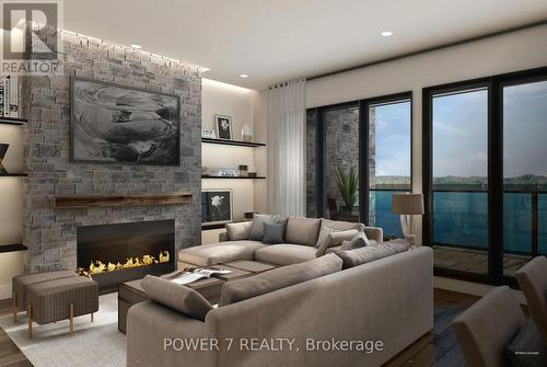 101 - 241 Crescent Bay Lane, Huntsville, ON - Indoor Photo Showing Living Room With Fireplace