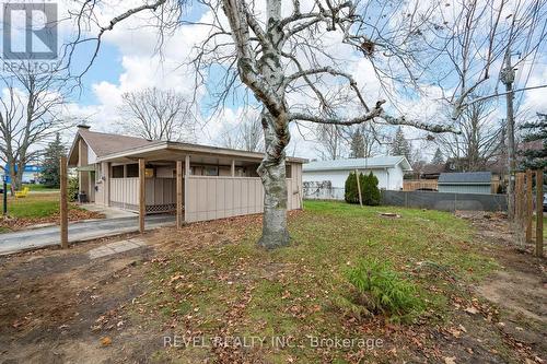 driveway and garage - posts installed for fence - 629 Victoria Street, Strathroy-Caradoc (Ne), ON - Outdoor