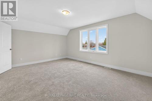 UPSTAIRS BEDROOM IS SPACIOUS + - 56 Dominion Road, Fort Erie (Lakeshore), ON - Indoor Photo Showing Other Room