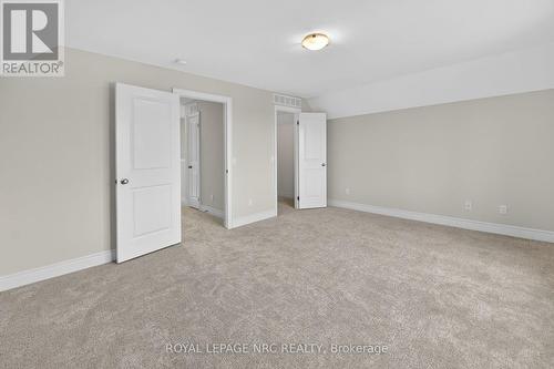 THE PRIMARY BEDROOM HAS NEW CARPETING - 56 Dominion Road, Fort Erie (Lakeshore), ON - Indoor Photo Showing Other Room