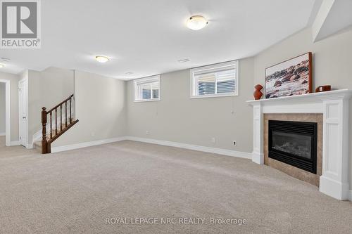 AND AN PARTIALLY OPEN WALL WITH RAILING - 56 Dominion Road, Fort Erie (Lakeshore), ON - Indoor With Fireplace