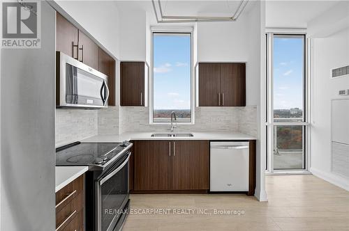 Ph03 - 65 Speers Road, Oakville, ON - Indoor Photo Showing Kitchen With Double Sink