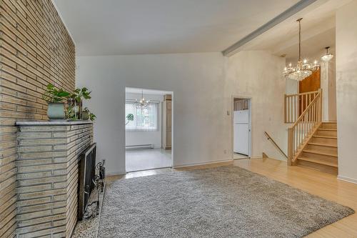 Living room - 4304 7E Rue, Laval (Chomedey), QC - Indoor Photo Showing Other Room With Fireplace