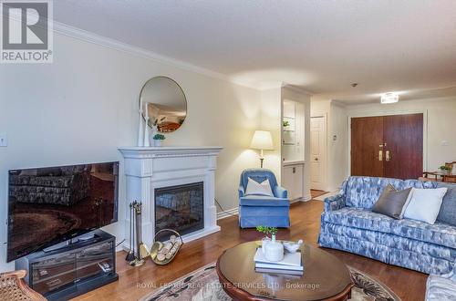 612 - 215 The Donway West, Toronto, ON - Indoor Photo Showing Living Room With Fireplace
