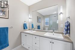 Beautiful ensuite with his and her sinks and a walk-in shower. - 