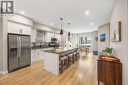 Large kitchen island, loads of counter space, and a Whirlpool appliance package, perfect for entertaining. - 