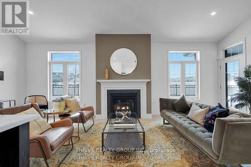 15 - 1080 Upperpoint Avenue, London South (South B), ON - Indoor Photo Showing Living Room With Fireplace