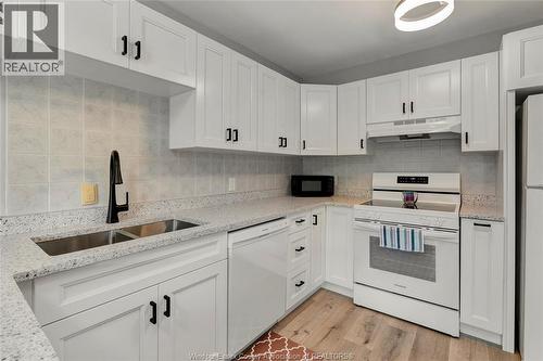 44 Robson Road Unit# 216, Leamington, ON - Indoor Photo Showing Kitchen With Double Sink