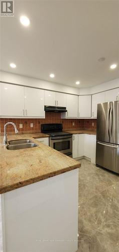 5058 Oscar Peterson Boulevard, Mississauga, ON - Indoor Photo Showing Kitchen With Double Sink