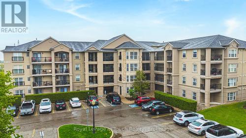 311 - 1491 Maple Avenue, Milton (De Dempsey), ON - Outdoor With Balcony With Facade