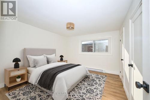 virtually staged photos - Unit 1 - 141 Plymouth Road, Welland (Lincoln/Crowland), ON - Indoor Photo Showing Bedroom