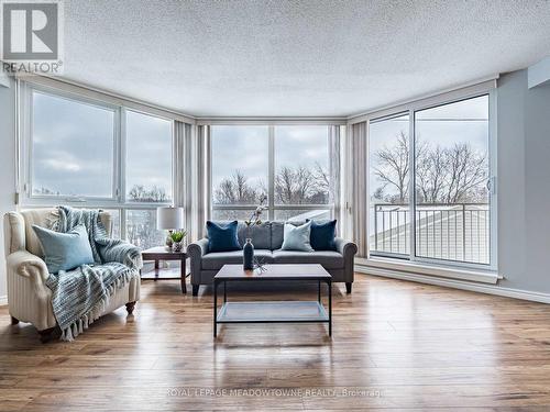 Walkout to balcony from living room - 306 - 26 Hall Road, Halton Hills, ON - Indoor Photo Showing Living Room
