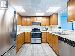 Kitchen provides generous cupboard & counter space - 