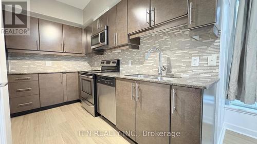 504 - 33 Bay Street, Toronto, ON - Indoor Photo Showing Kitchen With Double Sink With Upgraded Kitchen
