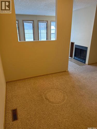 7231 Dalgliesh Drive, Regina, SK - Indoor Photo Showing Other Room With Fireplace