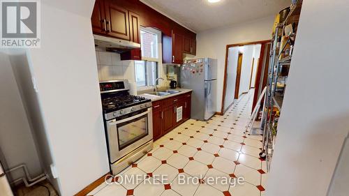 36 Mitchell Avenue, Toronto (Niagara), ON - Indoor Photo Showing Kitchen With Double Sink