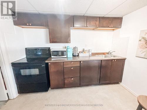 203 Roland Road, Temiskaming Shores (New Liskeard), ON - Indoor Photo Showing Kitchen With Double Sink