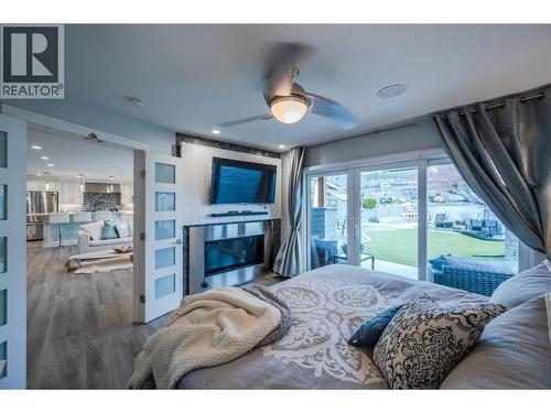 1362 Green Bay Road, West Kelowna, BC - Indoor Photo Showing Bedroom With Fireplace