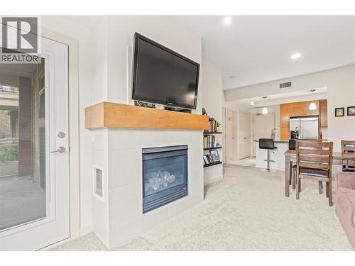 7343 Okanagan Landing Road Unit# 1112, Vernon, BC - Indoor Photo Showing Living Room With Fireplace