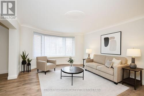 Virtually staged photos - Unit 6 - 141 Plymouth Road, Welland (Lincoln/Crowland), ON - Indoor Photo Showing Living Room