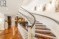 Grand staircase to 2nd floor primary suite. - 