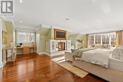 Primary bedroom feat. gas fireplace. - 