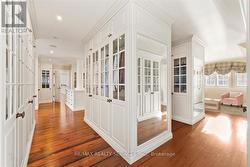 Custom millwork with floor to ceiling mirrors. - 