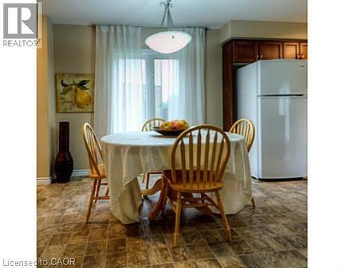 Dining area featuring stone finish flooring - 87 Iron Gate Street, Kitchener, ON - Indoor Photo Showing Dining Room