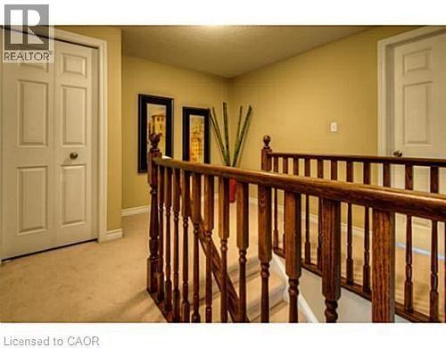 Hall with an upstairs landing and light carpet - 87 Iron Gate Street, Kitchener, ON - Indoor Photo Showing Other Room