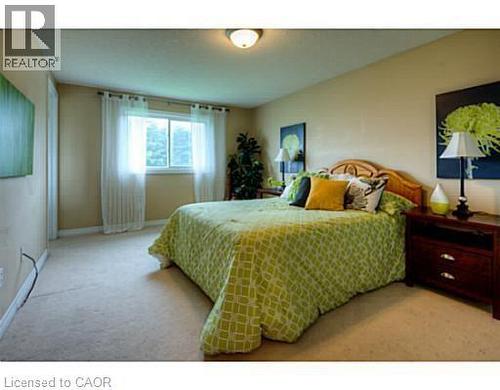 Bedroom featuring light colored carpet - 87 Iron Gate Street, Kitchener, ON - Indoor Photo Showing Bedroom