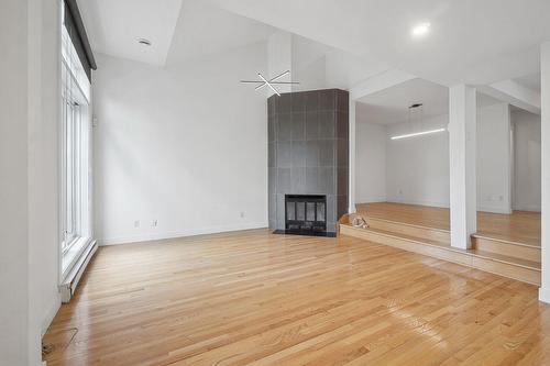 Overall view - 303-67 Rue Berlioz, Montréal (Verdun/Île-Des-Soeurs), QC - Indoor Photo Showing Other Room With Fireplace