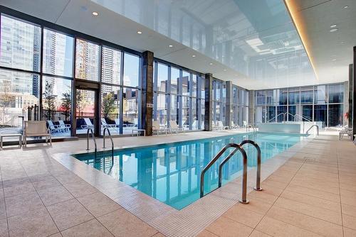 Piscine - 1002-1450 Boul. René-Lévesque O., Montréal (Ville-Marie), QC - Indoor Photo Showing Other Room With In Ground Pool