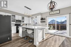 An Island with Four Breakfast Chairs - 