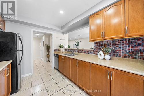 15 Snowgoose Terrace, Toronto, ON - Indoor Photo Showing Kitchen With Double Sink