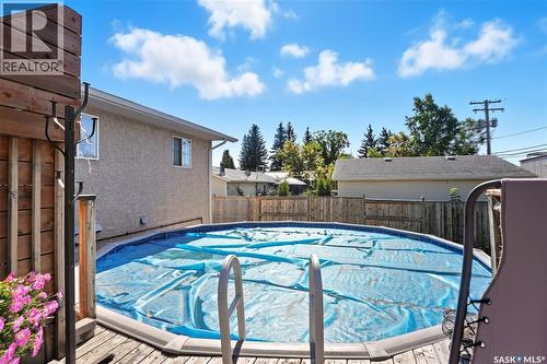 46 1St Avenue N, Martensville, SK - Outdoor With Above Ground Pool With Deck Patio Veranda