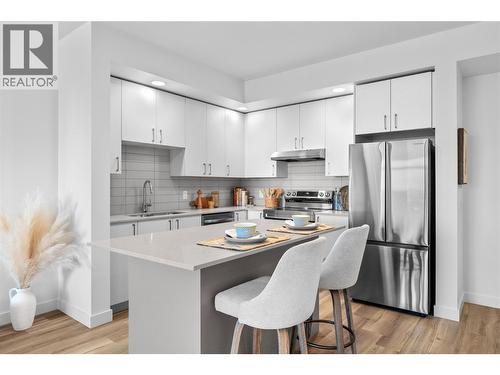 1 Bed | 1 Bath Riesling Condo-Photos are of a similar home; some features may vary - 1057 Frost Road Unit# 303, Kelowna, BC - Indoor Photo Showing Kitchen With Stainless Steel Kitchen