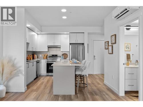 Kitchen & Dining- Photos are of a similar home; some features may vary - 1057 Frost Road Unit# 303, Kelowna, BC - Indoor Photo Showing Kitchen With Stainless Steel Kitchen
