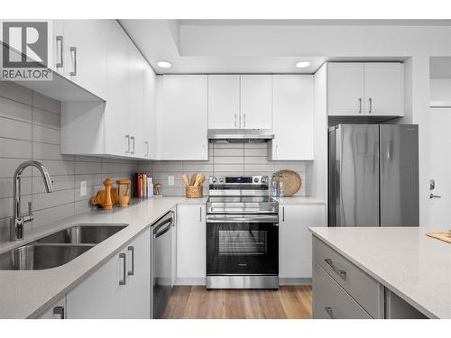 Kitchen- Photos are of a similar home; some features may vary - 1057 Frost Road Unit# 303, Kelowna, BC - Indoor Photo Showing Kitchen With Double Sink