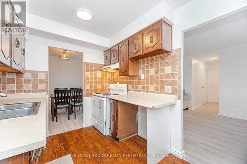 1407 - 3170 Kirwin Avenue, Mississauga, ON - Indoor Photo Showing Kitchen With Double Sink