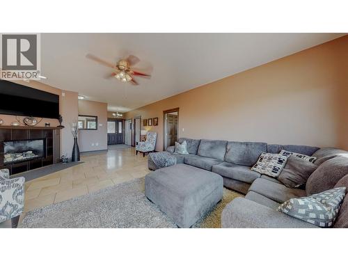 1370 Bullmoose Way, Osoyoos, BC - Indoor Photo Showing Living Room With Fireplace
