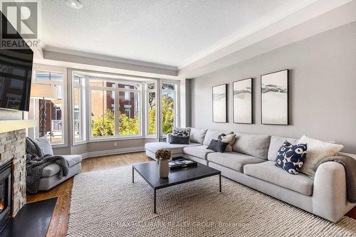 56 Kings Landing Private, Ottawa, ON - Indoor Photo Showing Living Room With Fireplace