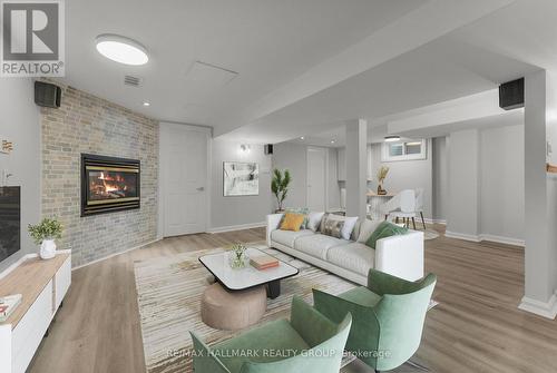 Photo Virtually Staged - 942 Elsett Drive, Ottawa, ON - Indoor Photo Showing Living Room With Fireplace