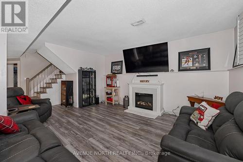 7028 Shadow Ridge Drive, Ottawa, ON - Indoor Photo Showing Living Room With Fireplace