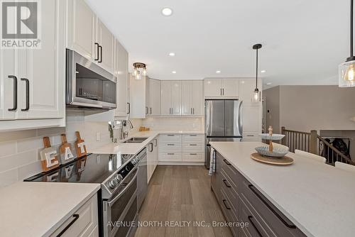 7028 Shadow Ridge Drive, Ottawa, ON - Indoor Photo Showing Kitchen With Stainless Steel Kitchen With Double Sink With Upgraded Kitchen