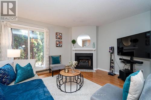 1713 - 1478 Pilgrims Way, Oakville, ON - Indoor Photo Showing Living Room With Fireplace