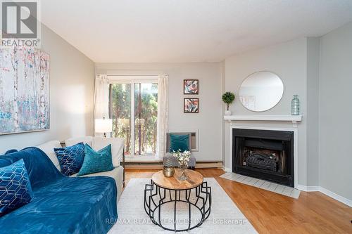 1713 - 1478 Pilgrims Way, Oakville, ON - Indoor Photo Showing Living Room With Fireplace