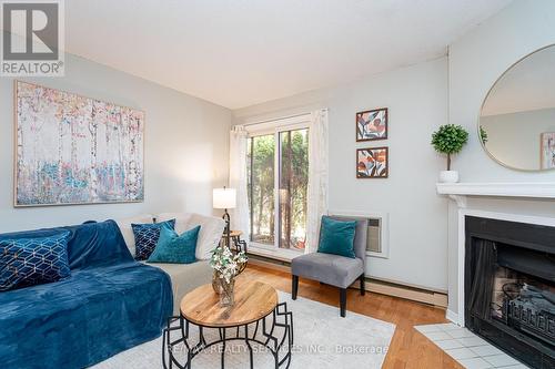 1713 - 1478 Pilgrims Way, Oakville, ON - Indoor Photo Showing Living Room With Fireplace