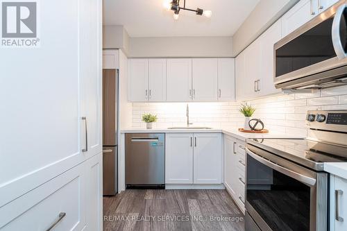 1713 - 1478 Pilgrims Way, Oakville, ON - Indoor Photo Showing Kitchen With Stainless Steel Kitchen With Upgraded Kitchen